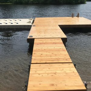 Floating dock with wave port